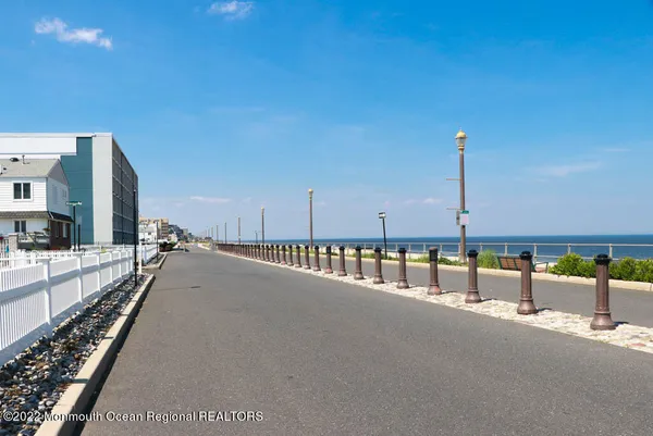 a view of a balcony with floor to ceiling window