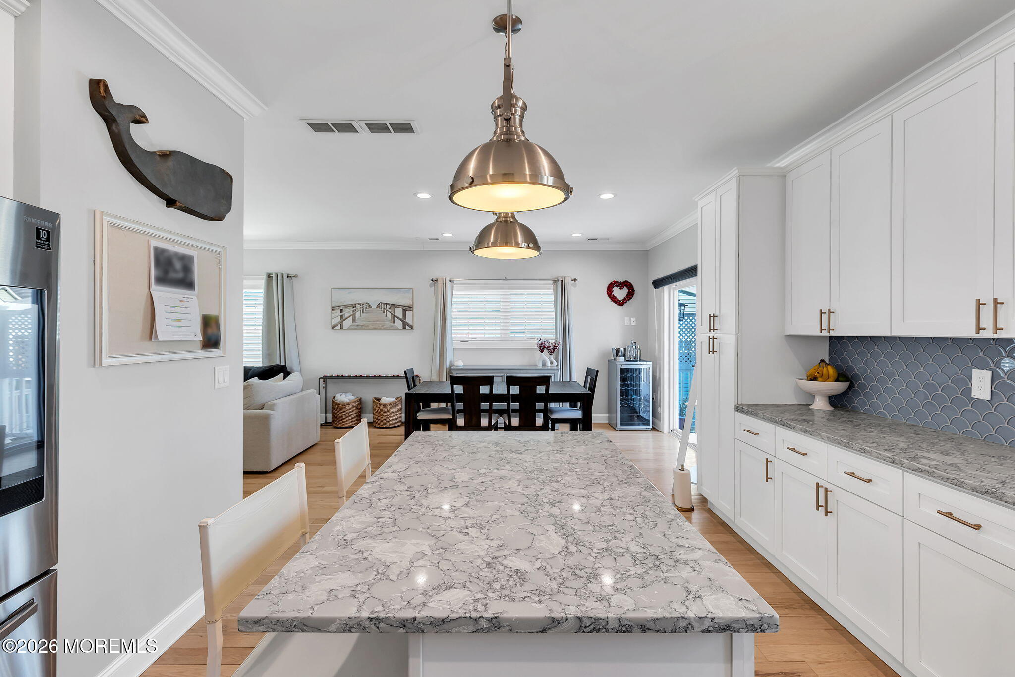 12 4th Street Highlands, NJ 07732 - Photo 12 of 41 a kitchen with stainless steel appliances granite countertop a stove and white cabinets