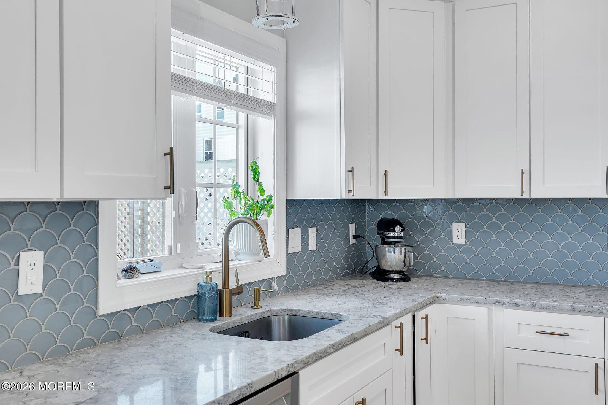 12 4th Street Highlands, NJ 07732 - Photo 15 of 41 a kitchen with white cabinets a sink and a window