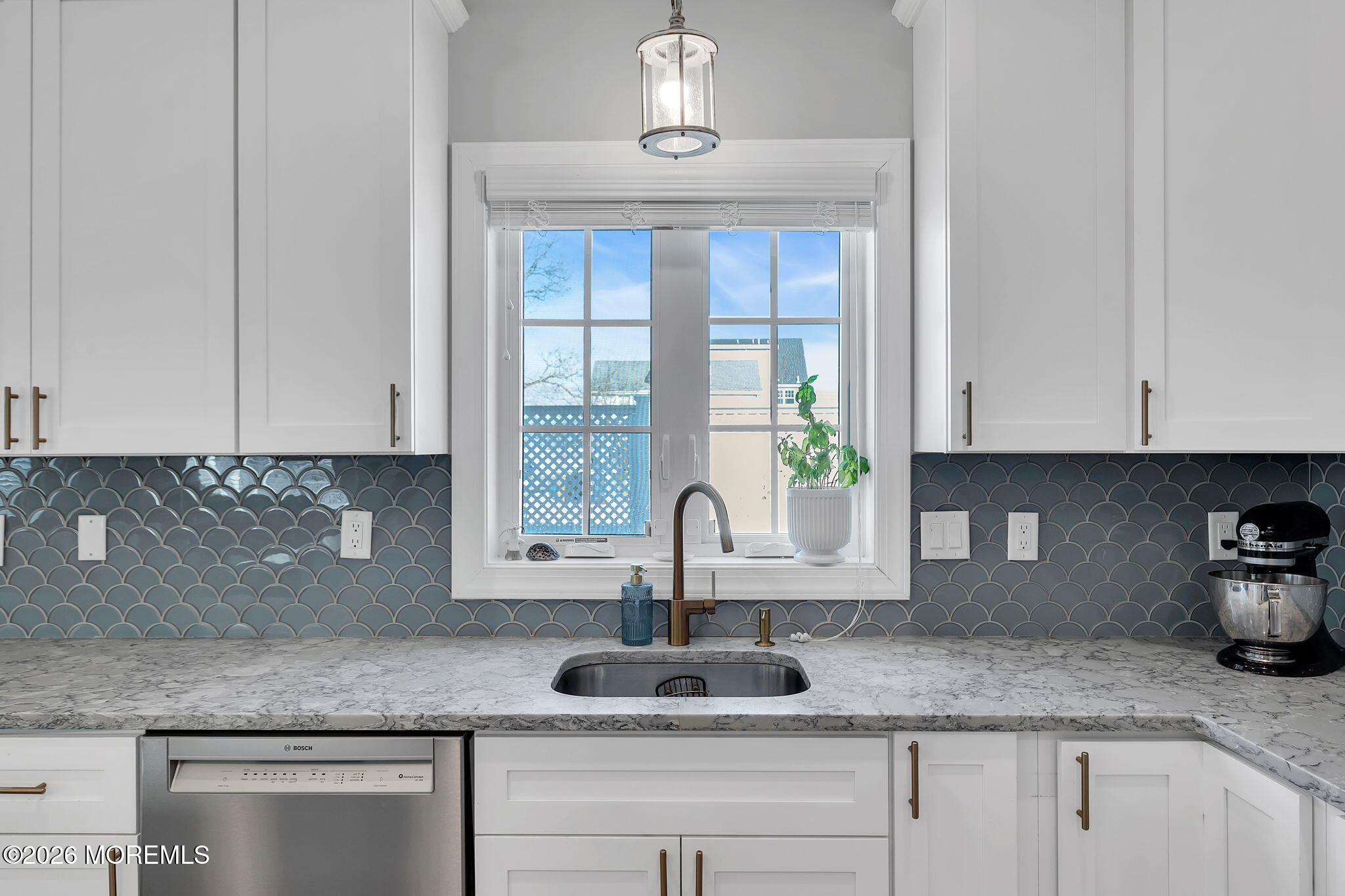 12 4th Street Highlands, NJ 07732 - Photo 17 of 41 a kitchen with granite countertop a sink and potted white wooden cabinets