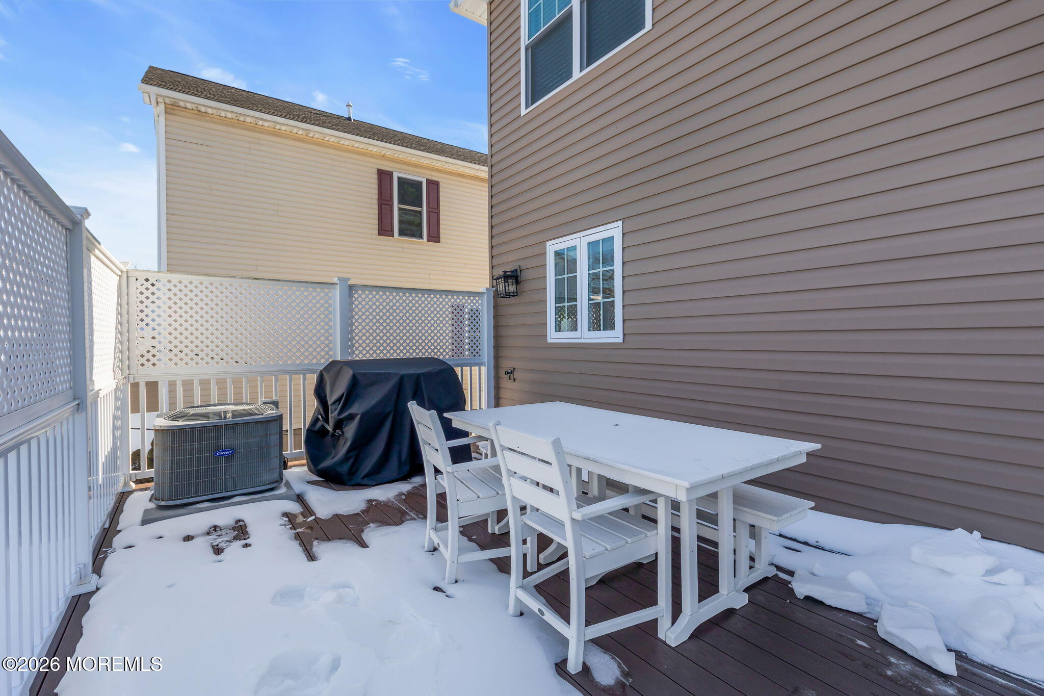 12 4th Street Highlands, NJ 07732 - Photo 26 of 41 a view of a patio with table and chairs with wooden floor and fence