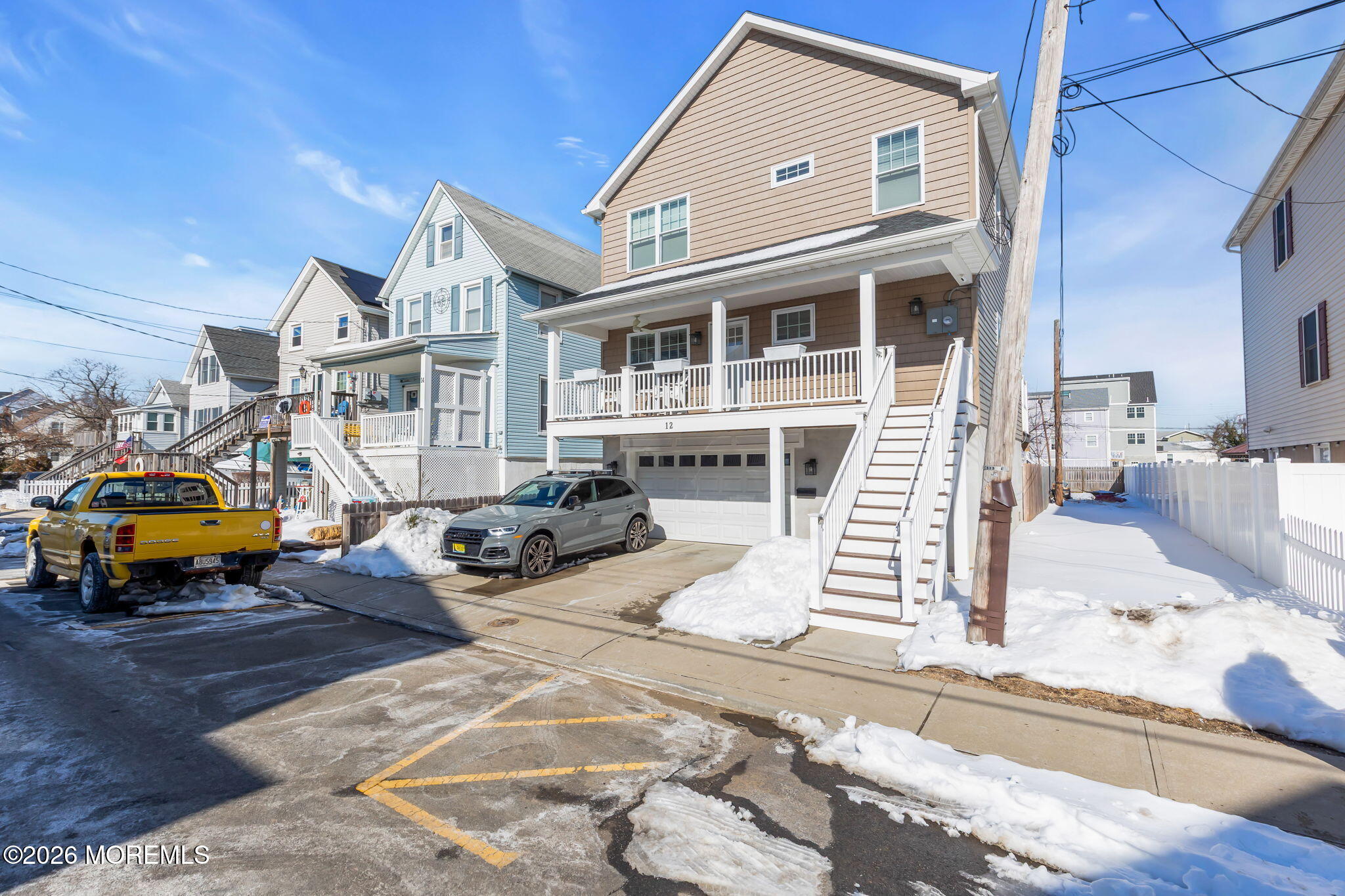 12 4th Street Highlands, NJ 07732 - Photo 31 of 41 a view of a white house with swimming pool in front of it