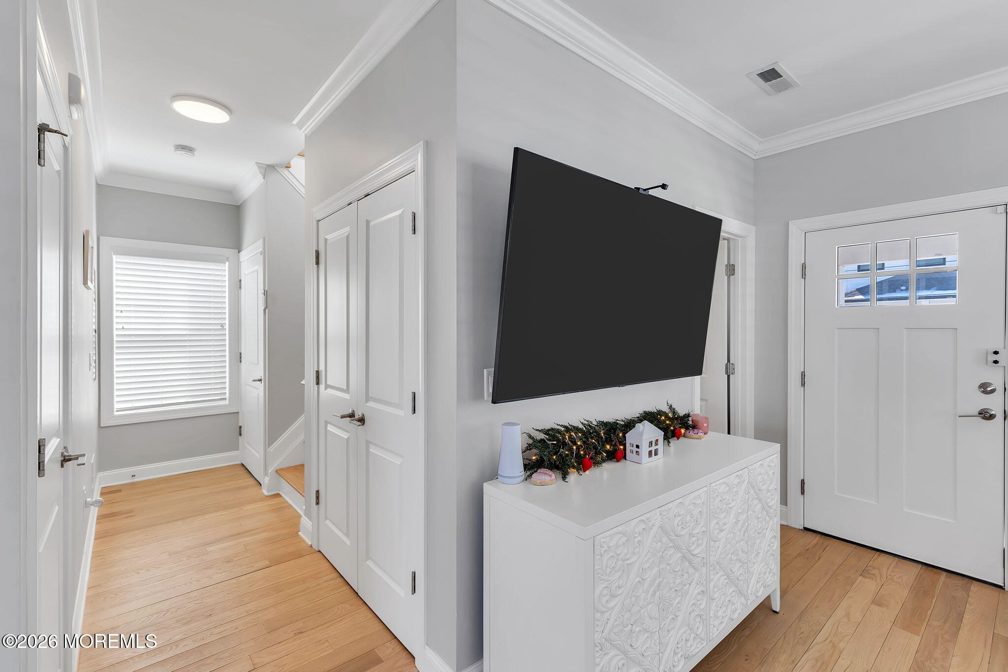 12 4th Street Highlands, NJ 07732 - Photo 35 of 41 a view of room with wooden floor and flat screen tv