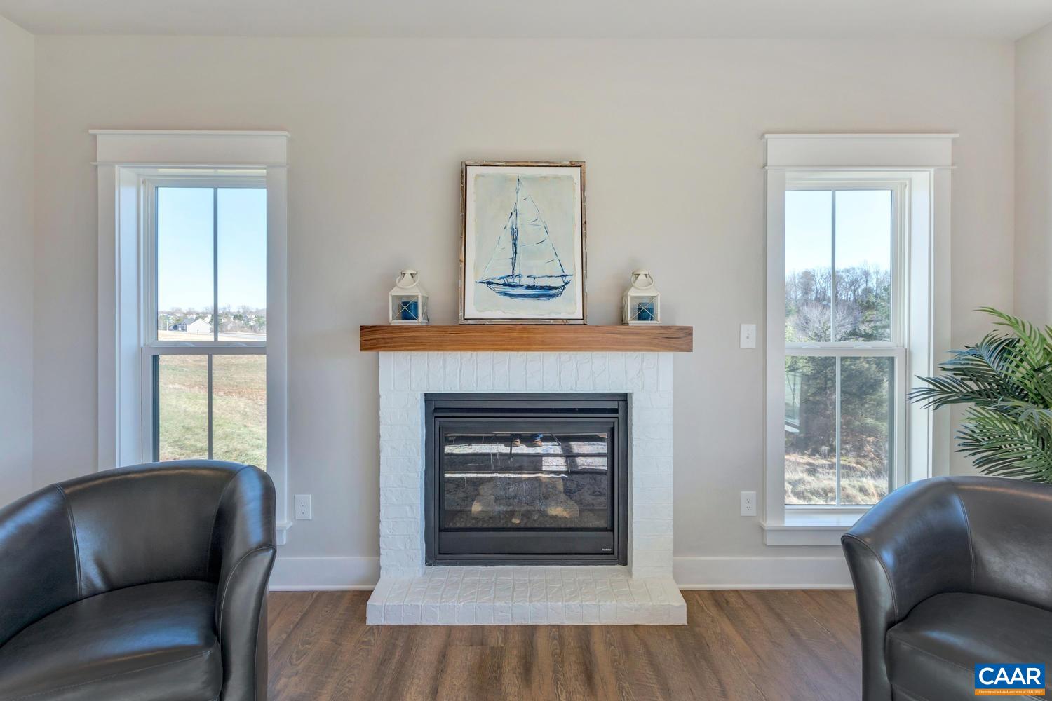 1300 Steep Rock Place Charlottesville, VA 22911 - Photo 14 of 60 a living room with furniture and a fireplace