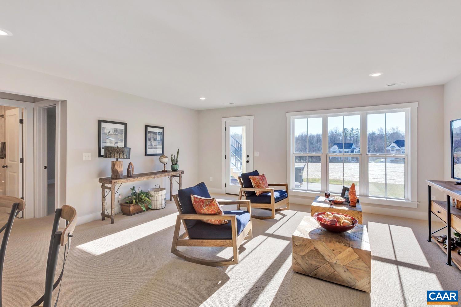 1300 Steep Rock Place Charlottesville, VA 22911 - Photo 42 of 60 a living room with furniture and a large window