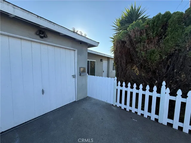 a view of a house with a small yard