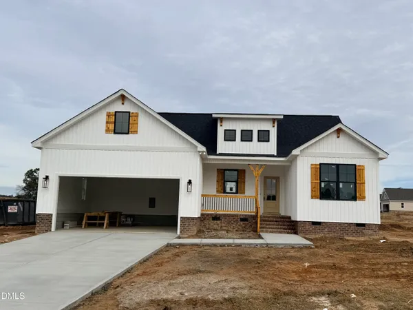 a front view of a house with a garage