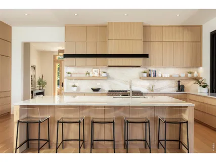 a kitchen with stainless steel appliances granite countertop a sink and cabinets