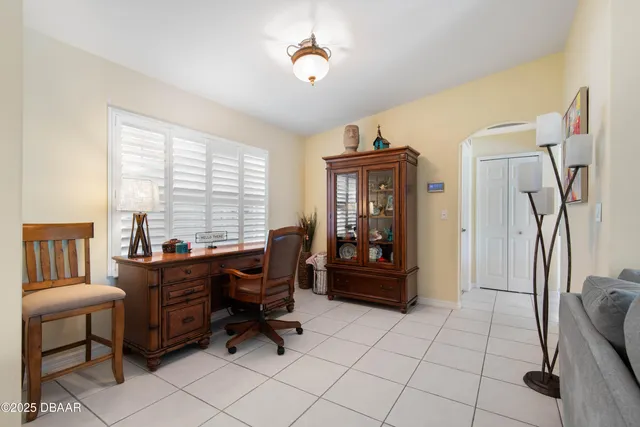 a en suite bathroom with a granite countertop sink and a mirror