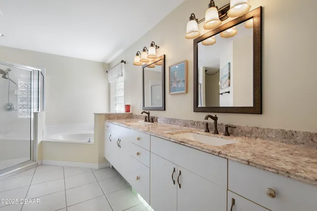 a bedroom with a bed and flat screen tv