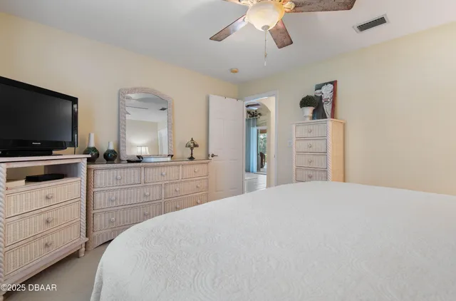 a view of a chairs and table in the backyard