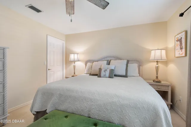 a view of a house with a backyard porch and sitting area