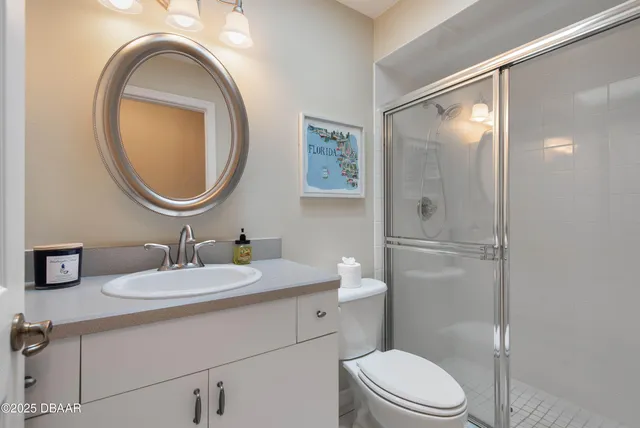 a view of a patio with a table and chairs under an umbrella