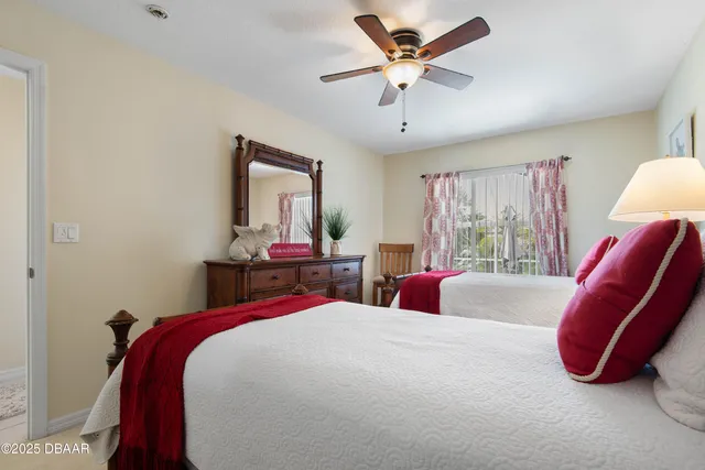 an outdoor sitting area with couch and chairs