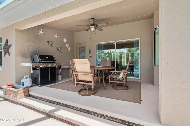 an aerial view of a house with garden space and a street view
