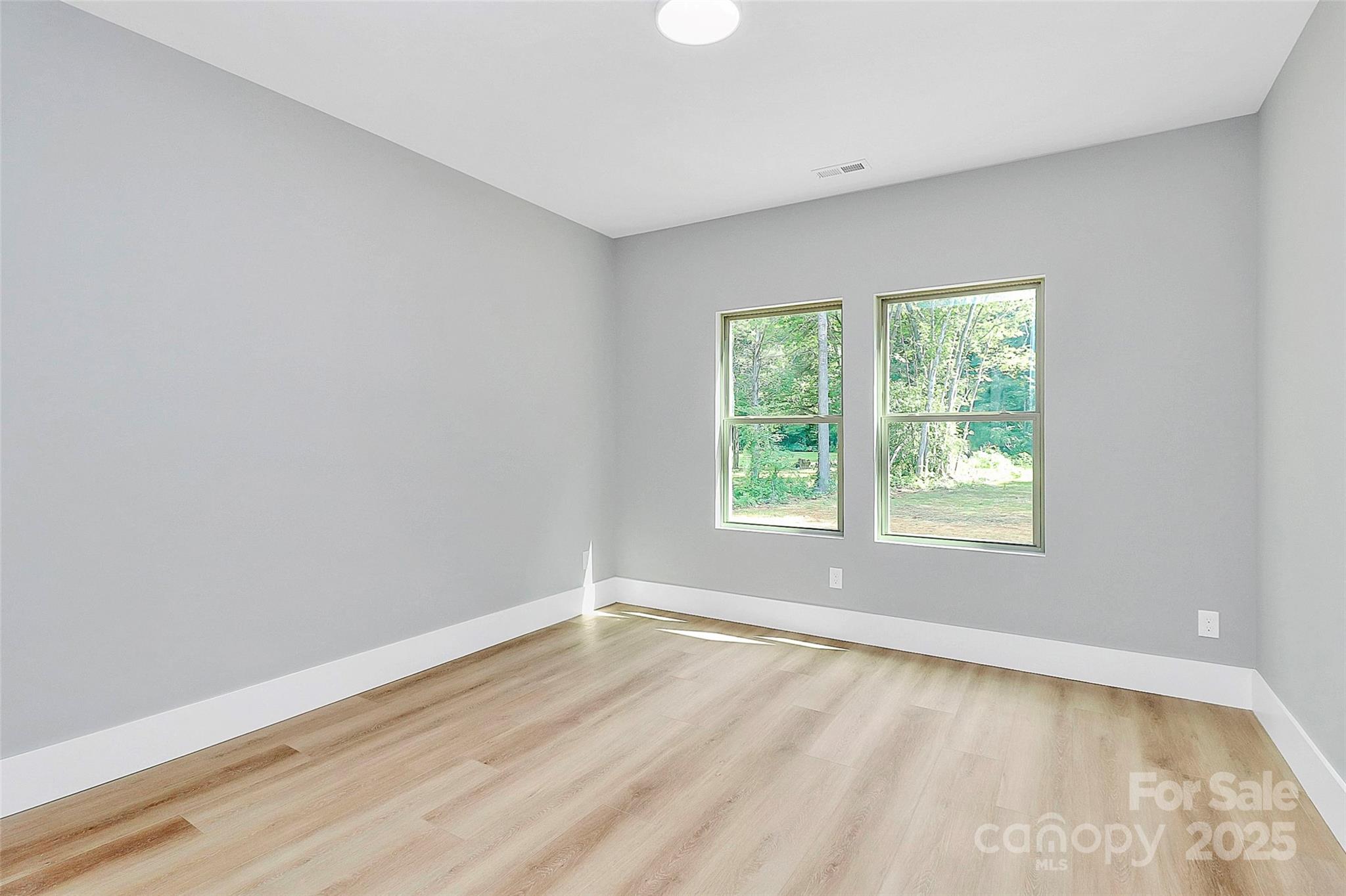 5516 Old York Road Rock Hill, SC 29732 - Photo 26 of 38 an empty room with wooden floor and windows