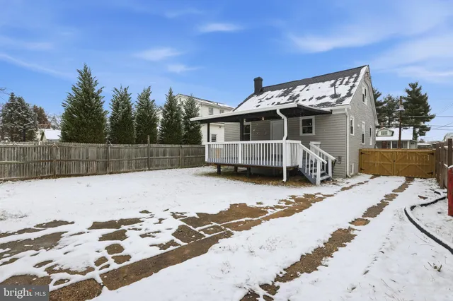 a view of a backyard with a bed and trees