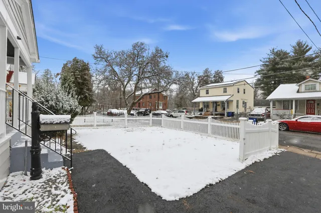 a view of a swimming pool with outdoor seating