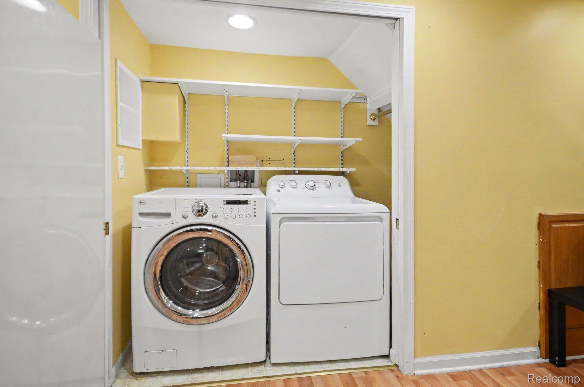425 Thornridge Court Rochester, MI 48307 - Photo 27 of 35 Dedicated laundry area featuring a front-load washer and a top-load dryer
