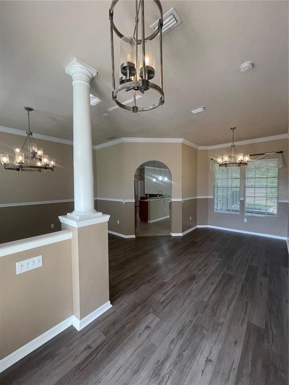 2244 Northwest 101st Street Gainesville, FL 32606 - Photo 11 of 39 an empty room with wooden floor and windows
