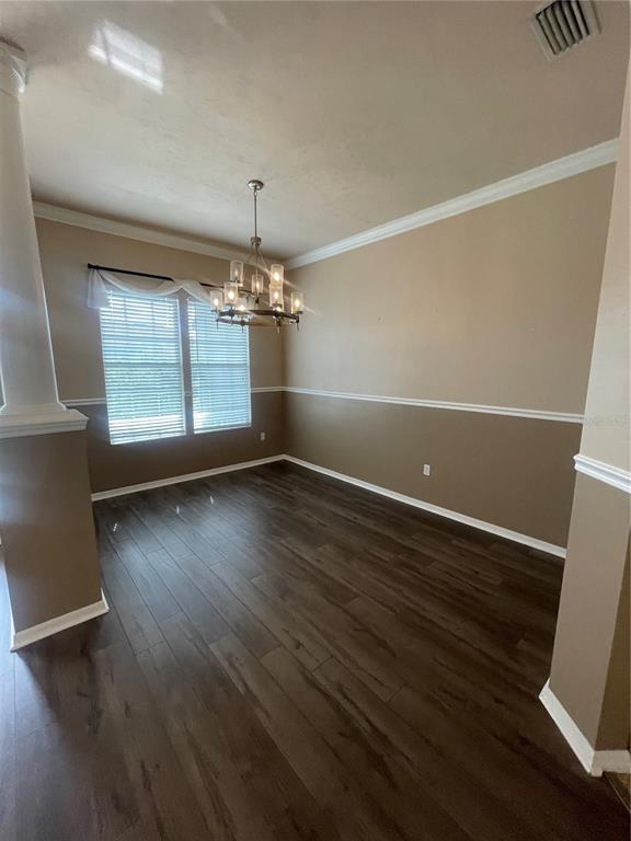 2244 Northwest 101st Street Gainesville, FL 32606 - Photo 12 of 39 an empty room with wooden floor and windows