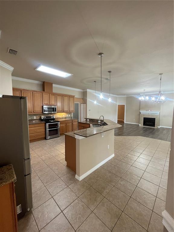 2244 Northwest 101st Street Gainesville, FL 32606 - Photo 18 of 39 a large kitchen with cabinets and stainless steel appliances