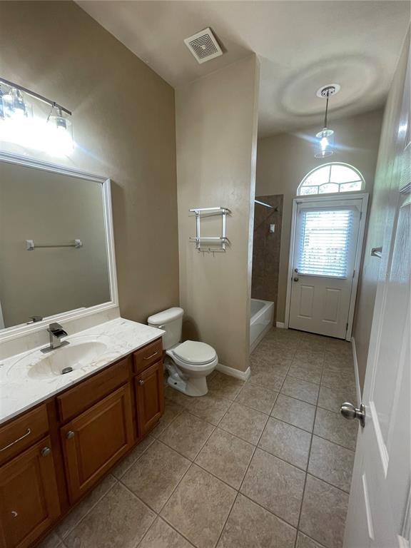 2244 Northwest 101st Street Gainesville, FL 32606 - Photo 26 of 39 a spacious bathroom with a sink toilet and mirror