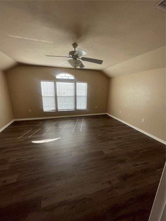 2244 Northwest 101st Street Gainesville, FL 32606 - Photo 31 of 39 a view of empty room with wooden floor and fan