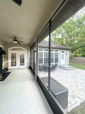a view of a house with backyard and balcony
