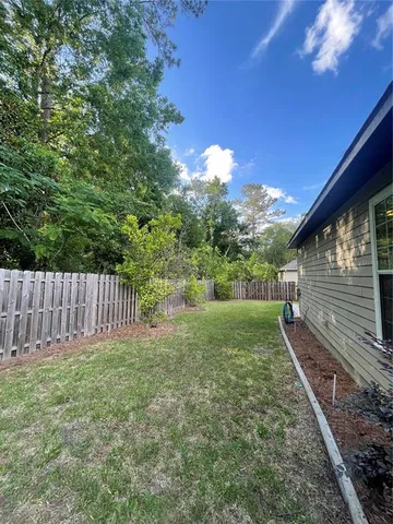 a view of backyard with green space