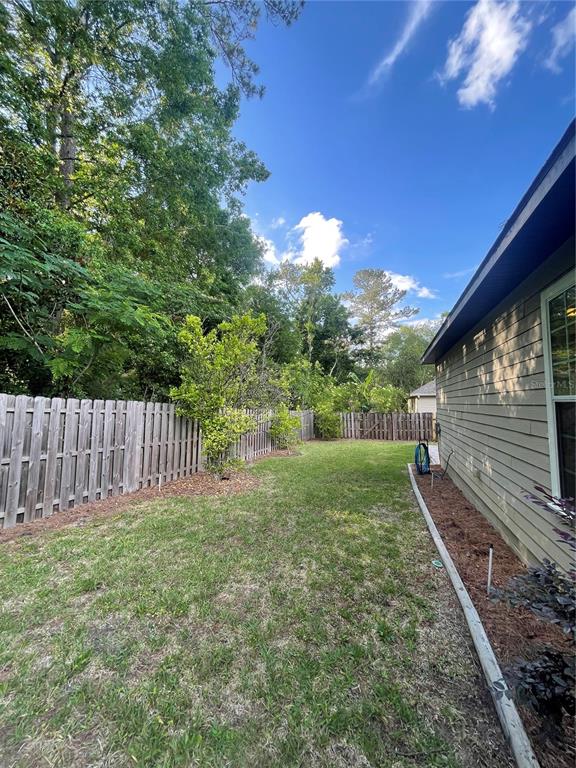 2244 Northwest 101st Street Gainesville, FL 32606 - Photo 37 of 39 a view of backyard with green space