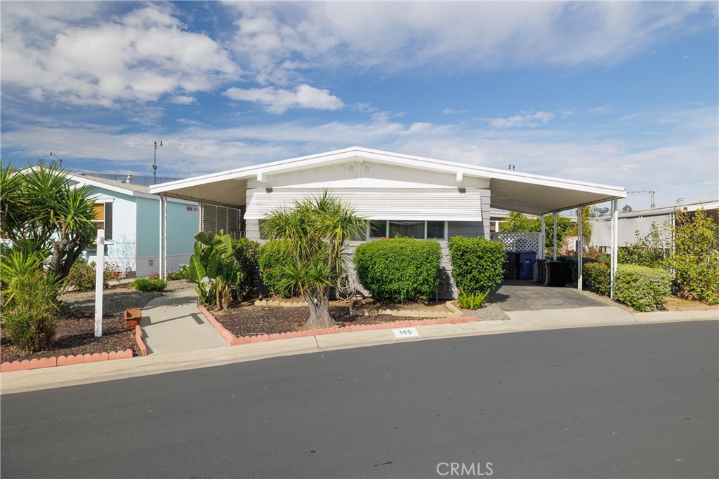 a view of a patio with a table and chairs under an umbrella