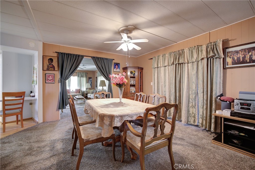 3700 Buchanan Street, Unit 105 Corona, CA 92503 - Photo 12 of 30 a view of a dining room with furniture window and wooden floor