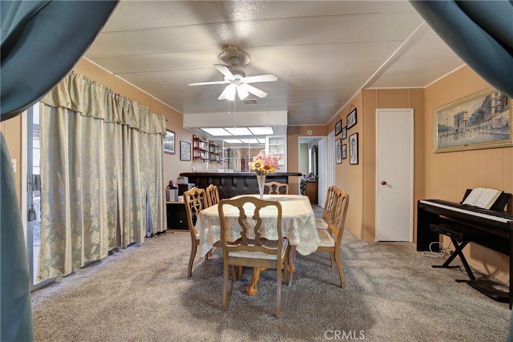 3700 Buchanan Street, Unit 105 Corona, CA 92503 - Photo 10 of 30 a dining room with furniture and window