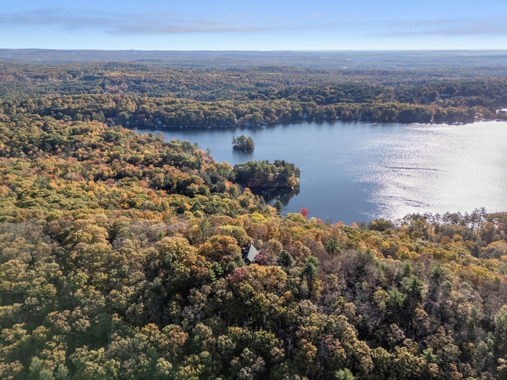an aerial view of a house with a lake view
