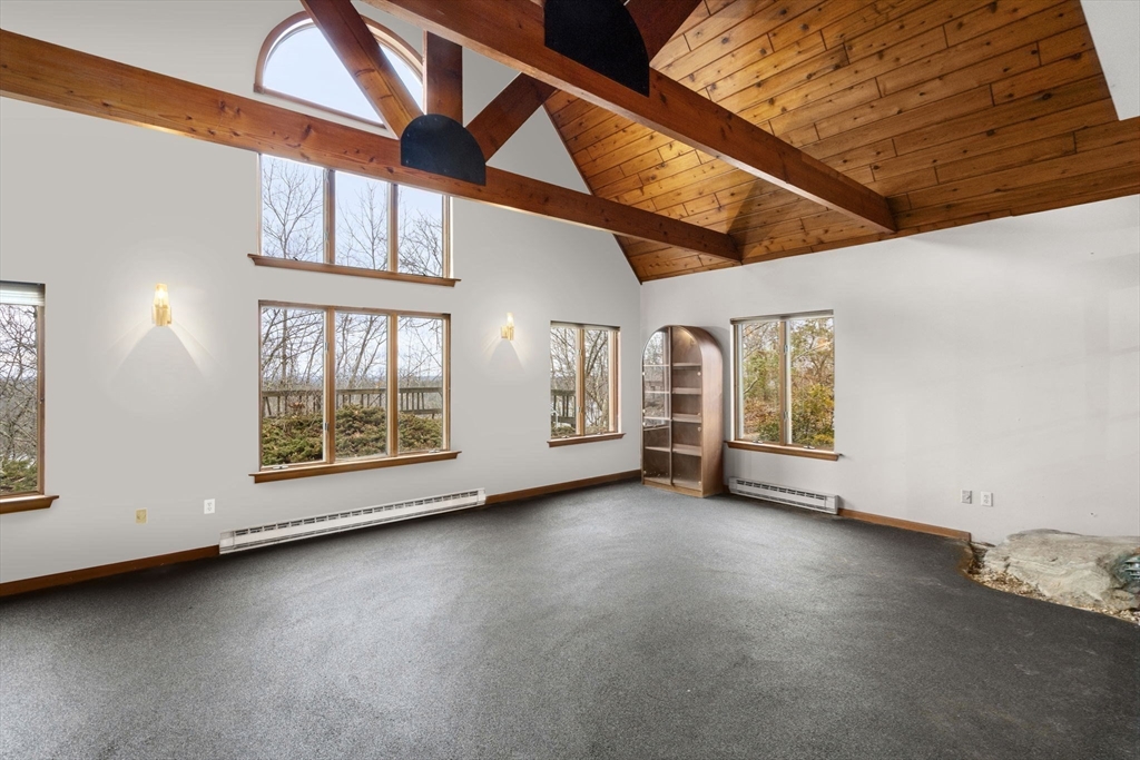 274 Brookfield Road Sturbridge, MA 01518 - Photo 13 of 30 an empty room with windows