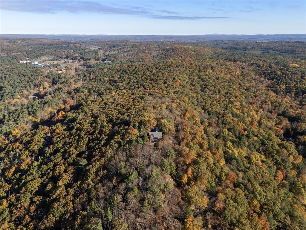 274 Brookfield Road Sturbridge, MA 01518 - Photo 9 of 30 an aerial view of residential houses with city view