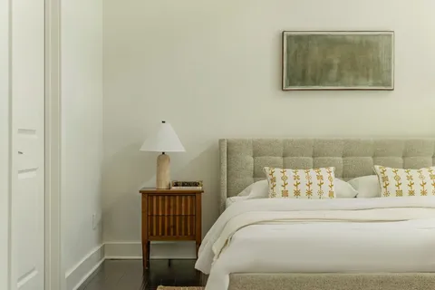 a bedroom with a bed and furniture
