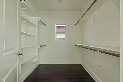 a view of an empty walk in closet