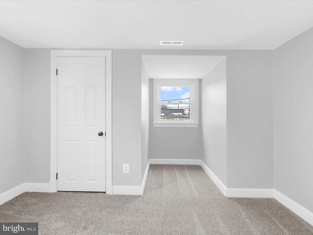 313 North Hammonds Ferry Road Linthicum Heights, MD 21090 - Photo 20 of 39 an empty room with windows