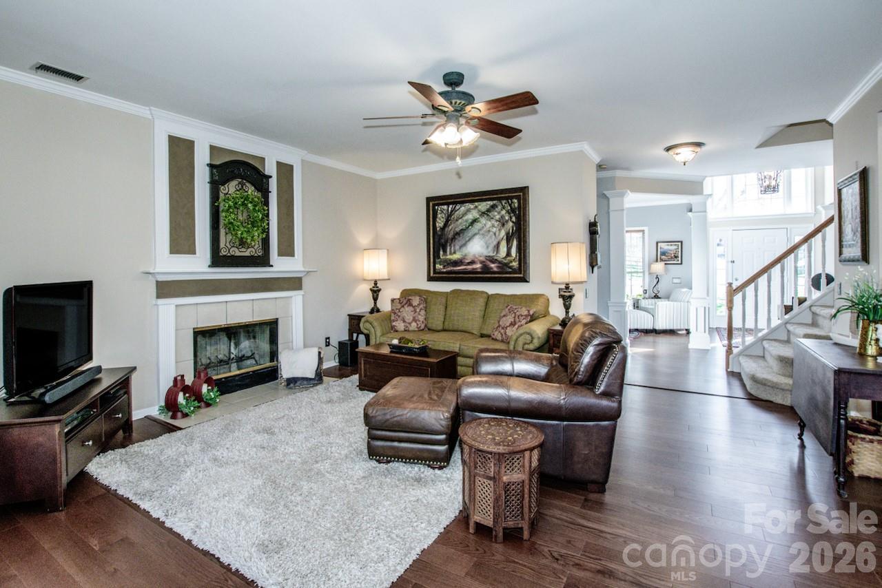 150 Coronilla Road Mooresville, NC 28117 - Photo 12 of 39 a living room with furniture a fireplace and a flat screen tv