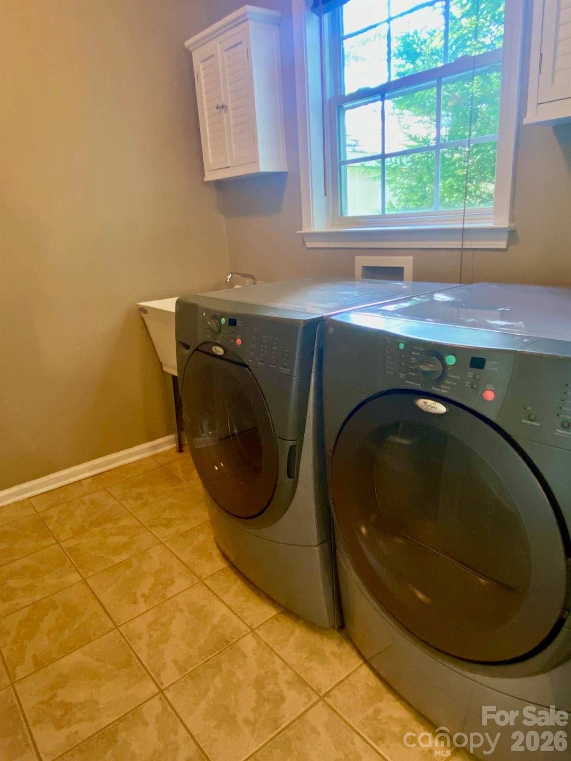 150 Coronilla Road Mooresville, NC 28117 - Photo 17 of 39 a utility room with a sink and window
