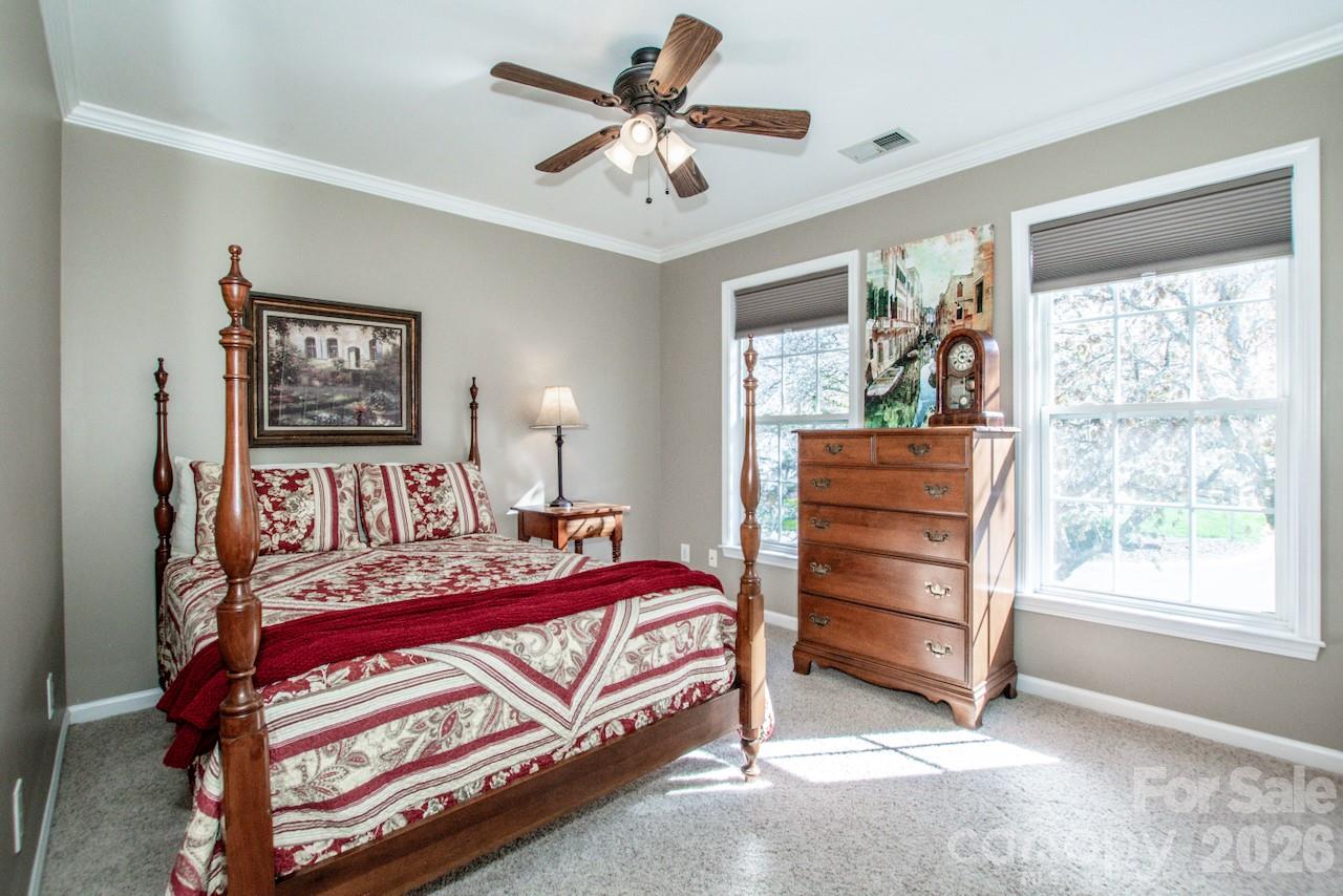 150 Coronilla Road Mooresville, NC 28117 - Photo 22 of 39 a bedroom with a bed and a window