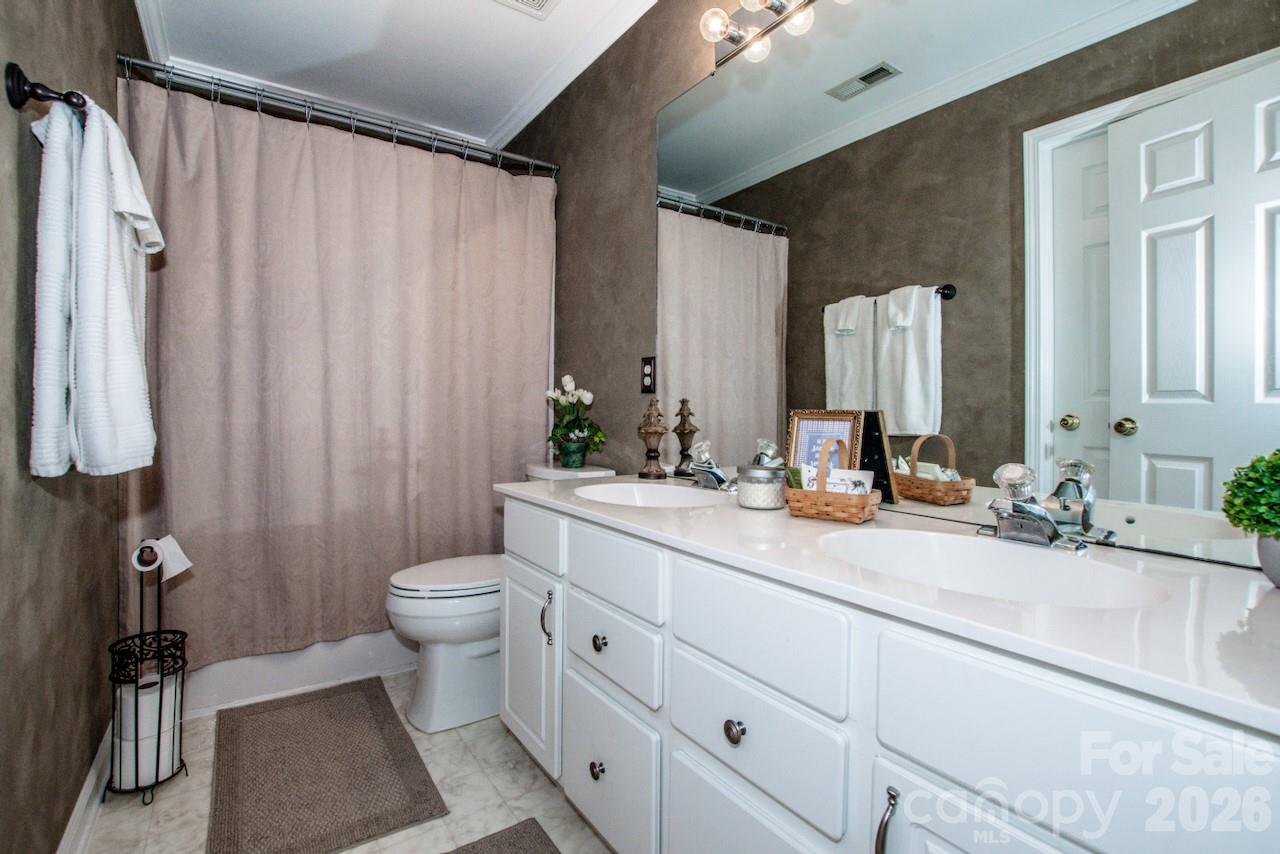 150 Coronilla Road Mooresville, NC 28117 - Photo 23 of 39 a bathroom with a double vanity sink toilet and shower