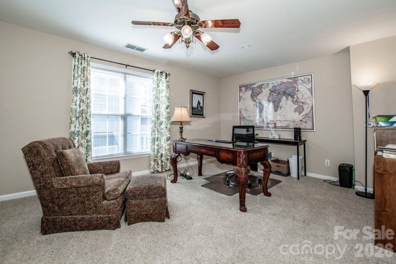 150 Coronilla Road Mooresville, NC 28117 - Photo 25 of 39 a living room with furniture and a large window