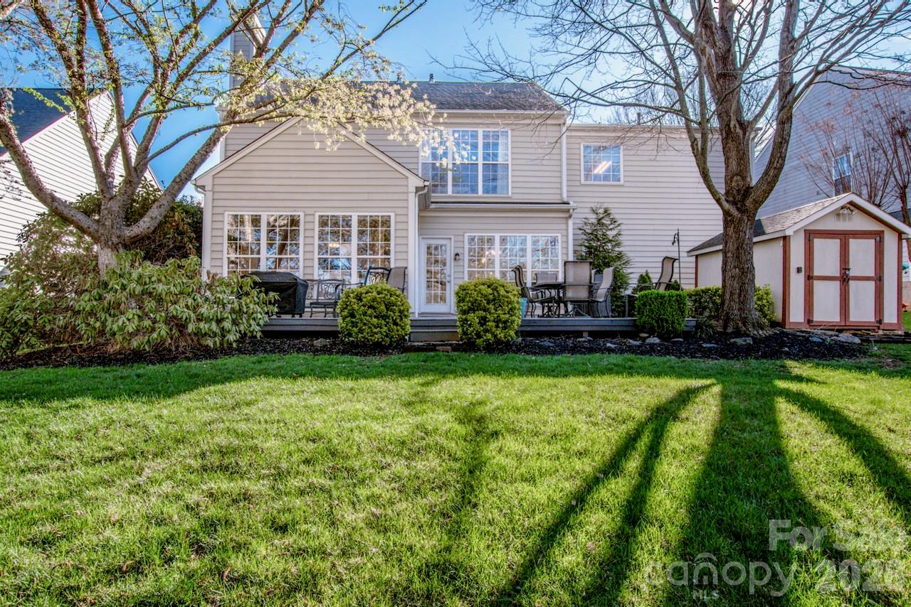 150 Coronilla Road Mooresville, NC 28117 - Photo 27 of 39 a front view of a house with a yard and trees