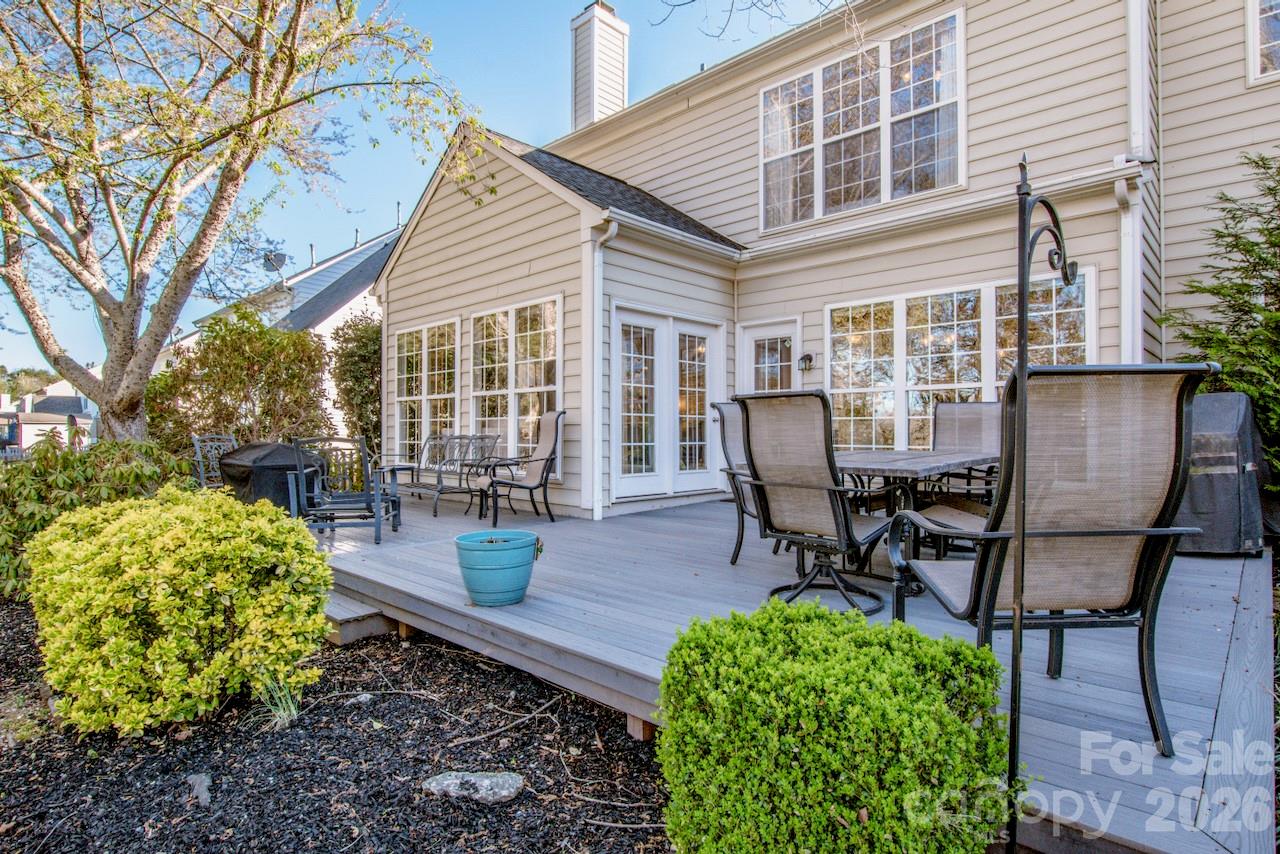 150 Coronilla Road Mooresville, NC 28117 - Photo 28 of 39 a view of a house with backyard sitting area and garden