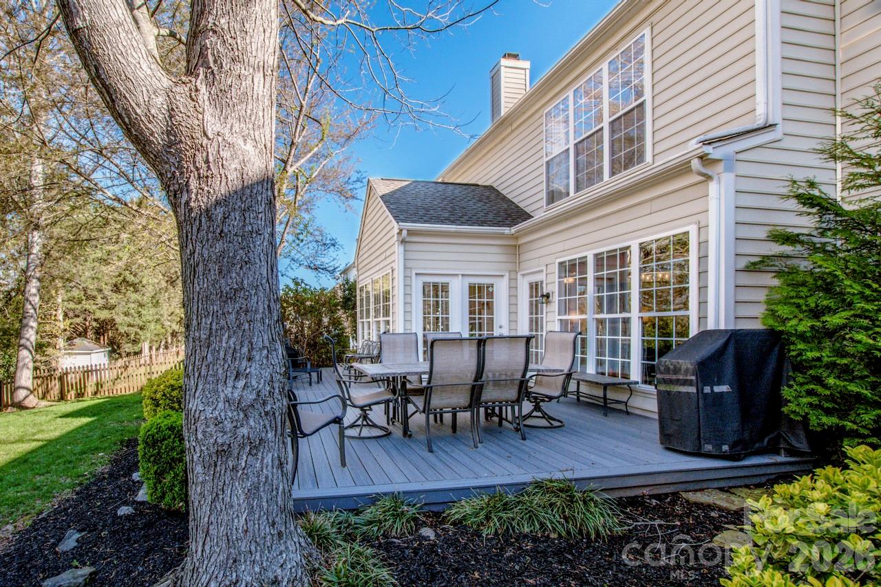 150 Coronilla Road Mooresville, NC 28117 - Photo 30 of 39 a house view with outdoor seating space and garden