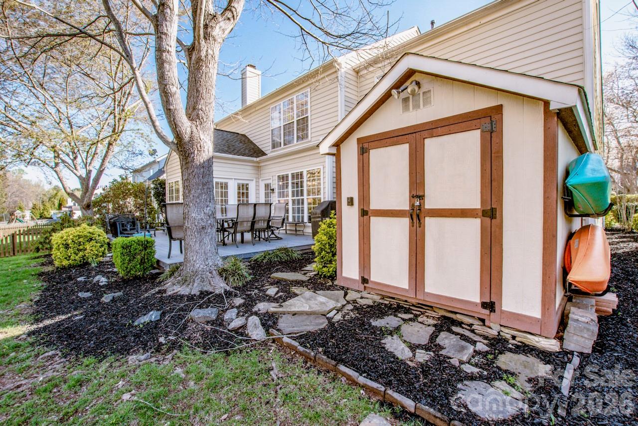 150 Coronilla Road Mooresville, NC 28117 - Photo 31 of 39 a view of a house with backyard and sitting area