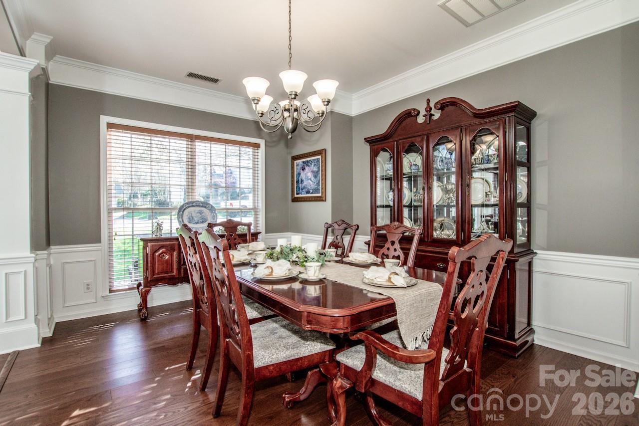150 Coronilla Road Mooresville, NC 28117 - Photo 8 of 39 a view of a dining room with furniture window and wooden floor